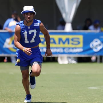 Jul 31, 2024; Los Angeles, CA, USA;  Los Angeles Rams wide receiver Puka Nacua (17) and quarterback Matthew Stafford (9) participate in jog through during training camp at Loyola Marymount University. Mandatory Credit: Kiyoshi Mio-USA TODAY Sports