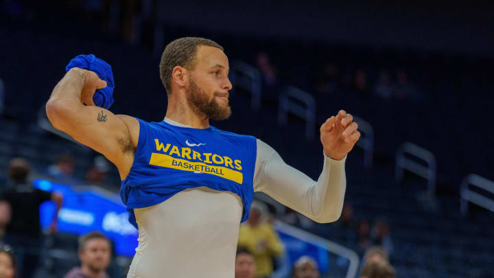 Mar 24, 2023; San Francisco, California, USA;  Golden State Warriors guard Stephen Curry (30) prepares to pass his balled up jersey during warmups before the start of the game against the Philadelphia 76ers at Chase Center. Mandatory Credit: Neville E. Guard-USA TODAY Sports