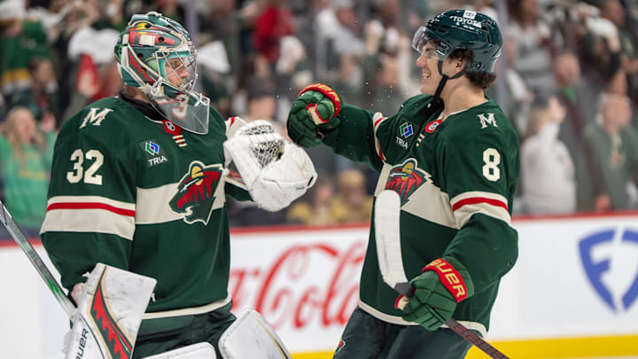 Apr 24, 2025; Saint Paul, Minnesota, USA; Minnesota Wild defenseman Zeev Buium (8) congratulates Minnesota Wild goaltender Filip Gustavsson (32) after after the final buzzer sounded and the Wild defeated the Vegas Golden Knights in game three of the first round of the 2025 Stanley Cup Playoffs at Xcel Energy Center. Mandatory Credit: Matt Blewett-Imagn Images