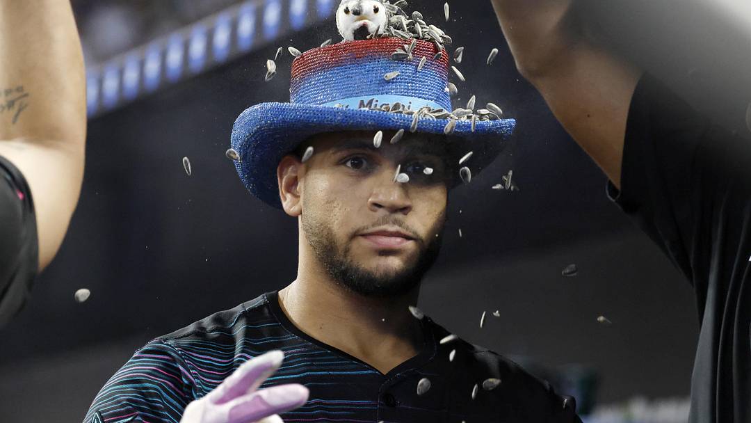 Aug 2, 2025; Miami, Florida, USA;  Miami Marlins catcher Agustin Ramirez (50) is showered with sunflower seeds in the dugout after hitting a home run against the New York Yankees during the first inning at loanDepot Park. Mandatory Credit: Rhona Wise-Imagn Images