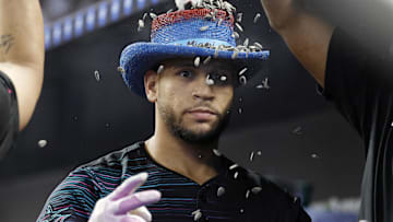 Aug 2, 2025; Miami, Florida, USA;  Miami Marlins catcher Agustin Ramirez (50) is showered with sunflower seeds in the dugout after hitting a home run against the New York Yankees during the first inning at loanDepot Park. Mandatory Credit: Rhona Wise-Imagn Images