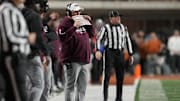 Nov 28, 2025; Austin, Texas, USA; Texas A&M Aggies head coach Mike Elko calls a play during the first half against the Texas Longhorns at Darrell K Royal-Texas Memorial Stadium. Mandatory Credit: Scott Wachter-Imagn Images