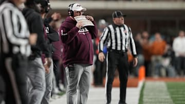Nov 28, 2025; Austin, Texas, USA; Texas A&M Aggies head coach Mike Elko calls a play during the first half against the Texas Longhorns at Darrell K Royal-Texas Memorial Stadium. Mandatory Credit: Scott Wachter-Imagn Images