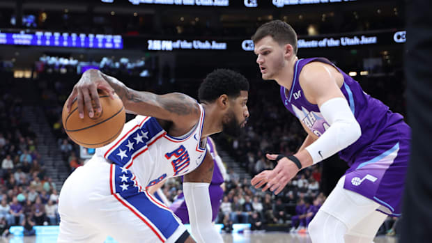 Philadelphia 76ers forward Paul George (8) drives against Utah Jazz center Walker Kessler (24) during the first quarter
