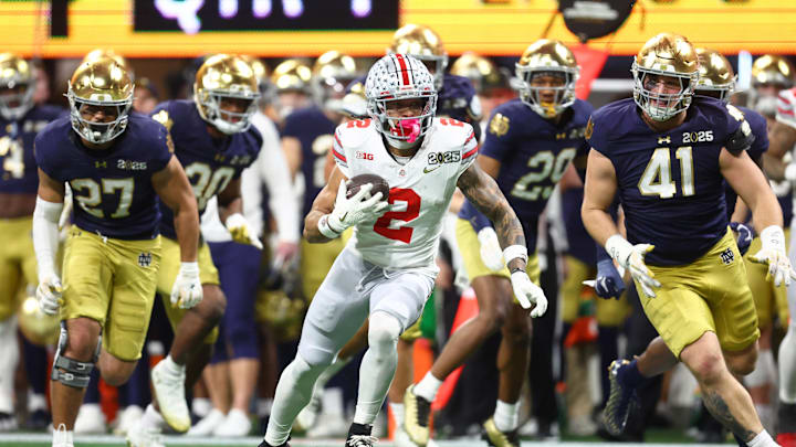 Jan 20, 2025; Atlanta, GA, USA; Ohio State Buckeyes wide receiver Emeka Egbuka (2) runs with the ball against the Notre Dame Fighting Irish during the second half the CFP National Championship college football game at Mercedes-Benz Stadium. Mandatory Credit: Mark J. Rebilas-Imagn Images