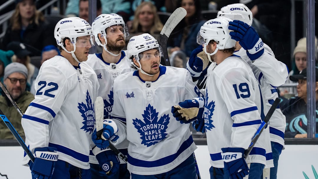 Jan 29, 2026; Seattle, Washington, USA; Toronto Maple Leafs, from left, defenseman Jake McCabe (22), defenseman Oliver Ekman-Larsson (95), forward Nicholas Robertson (89), forward Calle Jarnkrok (19) and forward Nicolas Roy (55) celebrate a goal during the first period at Climate Pledge Arena. Mandatory Credit: Stephen Brashear-Imagn Images