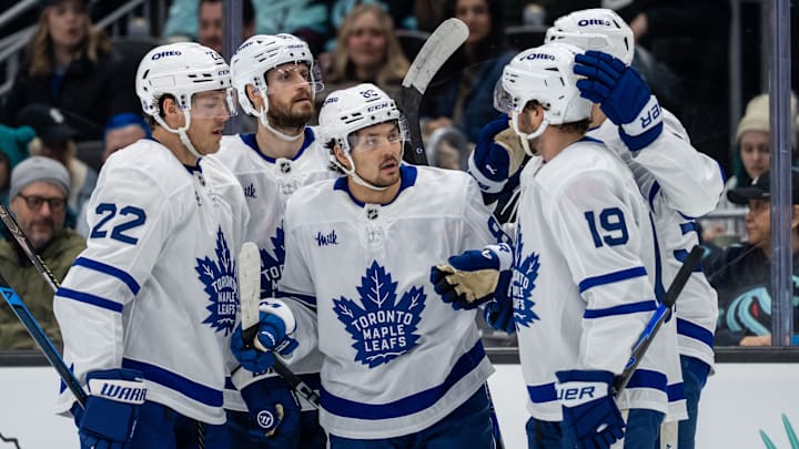 Jan 29, 2026; Seattle, Washington, USA; Toronto Maple Leafs, from left, defenseman Jake McCabe (22), defenseman Oliver Ekman-Larsson (95), forward Nicholas Robertson (89), forward Calle Jarnkrok (19) and forward Nicolas Roy (55) celebrate a goal during the first period at Climate Pledge Arena. Mandatory Credit: Stephen Brashear-Imagn Images