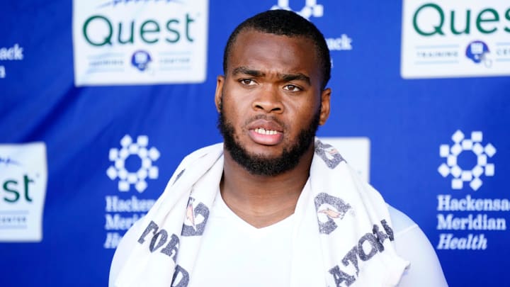 New York Giants offensive tackle Evan Neal talks to reporters after the organized team activities (OTA's) at the Giants training center on Wednesday, May 31, 2023, in East Rutherford.