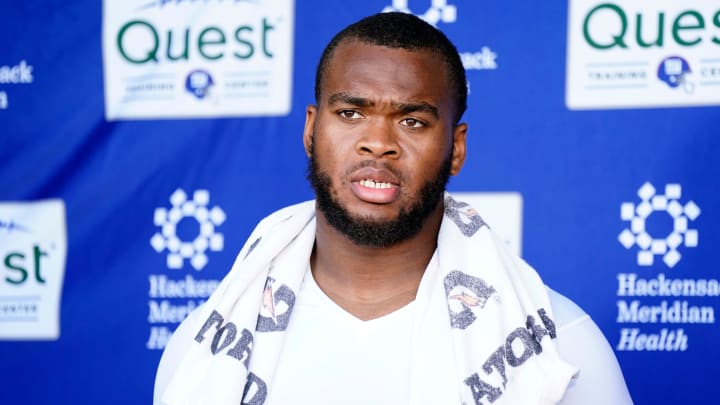 New York Giants offensive tackle Evan Neal talks to reporters after the organized team activities (OTA's) at the Giants training center on Wednesday, May 31, 2023, in East Rutherford.