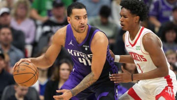 Mar 10, 2024; Sacramento, California, USA; Sacramento Kings forward Trey Lyles (41) dribbles against Houston Rockets forward Amen Thompson (1) during the third quarter at Golden 1 Center. Mandatory Credit: Darren Yamashita-USA TODAY Sports