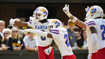 Sep 6, 2025; Columbia, Missouri, USA; Kansas Jayhawks defensive back Austin Alexander (0) celebrates with teammates after recovering a fumble for a touchdown during the first half against the Missouri Tigers at Faurot Field at Memorial Stadium. Mandatory Credit: Jay Biggerstaff-Imagn Images