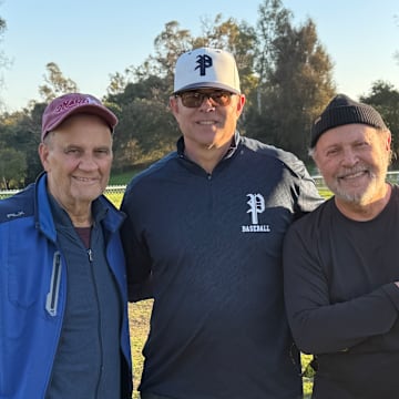 Palisades baseball coach Mike Voelkel (center) with Joe Torre (left) and Billy Crystal.