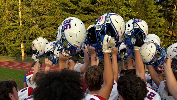 The Mount Anthony Union High School football team huddles up after beating Colchester 26-6 on Friday, Sept. 20, 2024.