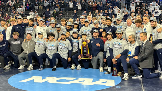 The Penn State wrestling team celebrates winning the team title at the 2025 NCAA Wrestling Championships.