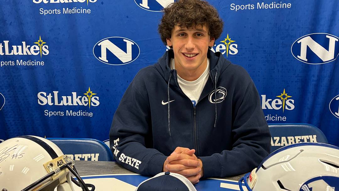 Penn State quarterback commit Peyton Falzone of Nazareth (Pa.) High at his Signing Day ceremony with Penn State and Nazareth helmets. Penn State quarterback commit Peyton Falzone of Nazareth (Pa.) High at his Signing Day ceremony with Penn State and Nazareth helmets.