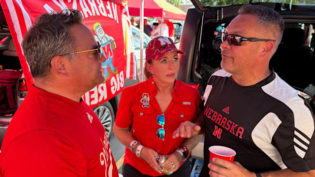 Kelli Anne (middle) chats with two of her closer friends at her traditional tailgate.