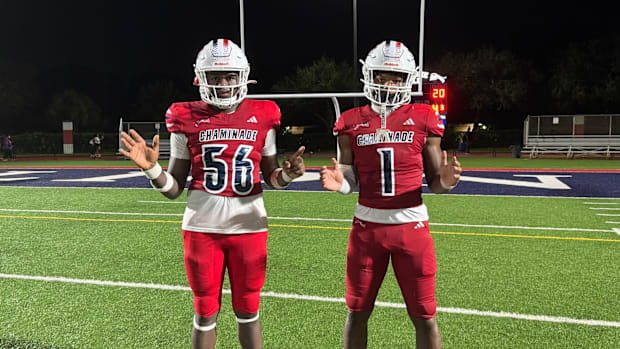 RJ Alphonse (56) and Derrek Cooper (1) come up big defensively for the Lions