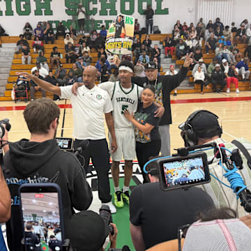 Inglewood senior Jason Crowe Jr. (center) poses for a picture after breaking California's all-time career scoring record against Beverly Hills at Morningside High on December 9, 2025.