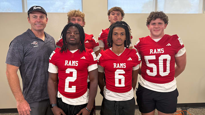 Lake Mary football coach, Scott Perry,  far left, is ready to take the Rams on another big run in 2025. Last year, Lake Mary went 12-3 and finished as Class 7A state runner-up.