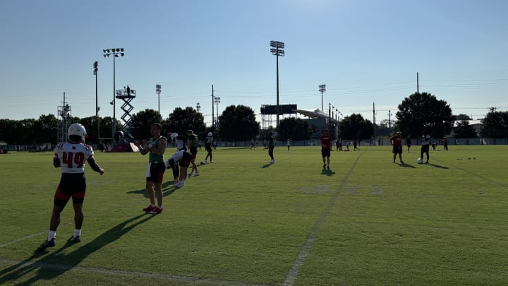 Louisville opens up a practice session during their preseason fall camp.