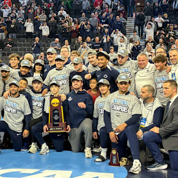 The Penn State wrestling team celebrates winning the team title at the 2025 NCAA Wrestling Championships.