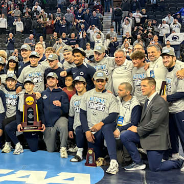 The Penn State wrestling team celebrates winning the team title at the 2025 NCAA Wrestling Championships.