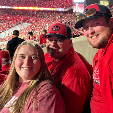 Scott Cyboron (middle) held an Ironman streak at Memorial Stadium for many years, but since breaking his streak continues to enjoy the atmosphere of Nebraska Football with his family and friends in South Stadium. 