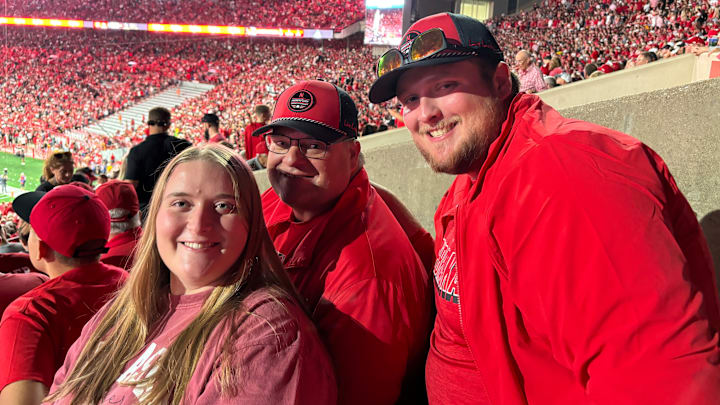 Scott Cyboron (middle) held an Ironman streak at Memorial Stadium for many years, but since breaking his streak continues to enjoy the atmosphere of Nebraska Football with his family and friends in South Stadium. 