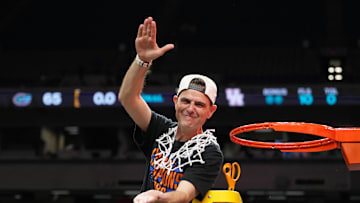 Apr 7, 2025; San Antonio, TX, USA; Florida Gators head coach Todd Golden reacts after cutting down a piece of the net after winning the national championship game of the Final Four of the 2025 NCAA Tournament at the Alamodome. Mandatory Credit: Bob Donnan-Imagn Images