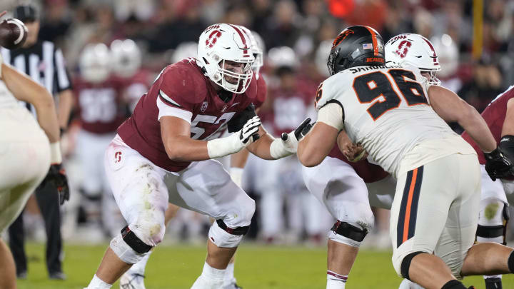 Oct 8, 2022; Stanford, California, USA; Stanford Cardinal guard Levi Rogers (57) blocks Oregon State Beavers defensive lineman Simon Sandberg (96) during the second quarter at Stanford Stadium. Mandatory Credit: Darren Yamashita-USA TODAY Sports