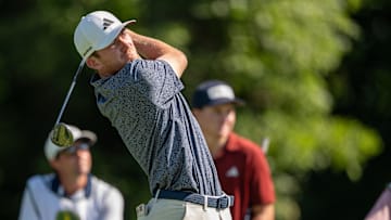Nick Dunlap tees off on the 13th hole during the second round of the John Deere Classic golf tournament.