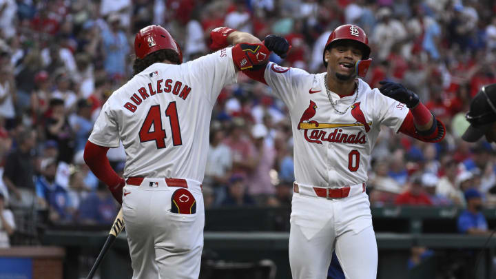 Jul 13, 2024; St. Louis, Missouri, USA; St. Louis Cardinals shortstop Masyn Winn (0) celebrates with first baseman Alec Burleson (41) after hitting a home run against the Chicago Cubs during the first inning at Busch Stadium. Mandatory Credit: Jeff Le-USA TODAY Sports