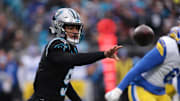 Nov 30, 2025; Charlotte, North Carolina, USA; Carolina Panthers quarterback Bryce Young (9) hands the ball off during the first quarter against the Los Angeles Rams at Bank of America Stadium. Mandatory Credit: Scott Kinser-Imagn Images