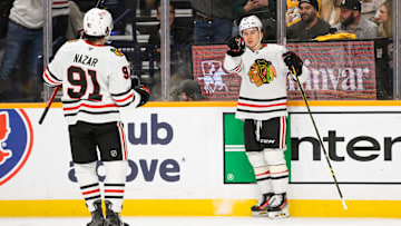 Jan 16, 2025; Nashville, Tennessee, USA;  Chicago Blackhawks center Connor Bedard (98) celebrates his goal with center Frank Nazar (91) against the Nashville Predators during the second period at Bridgestone Arena. Mandatory Credit: Steve Roberts-Imagn Images