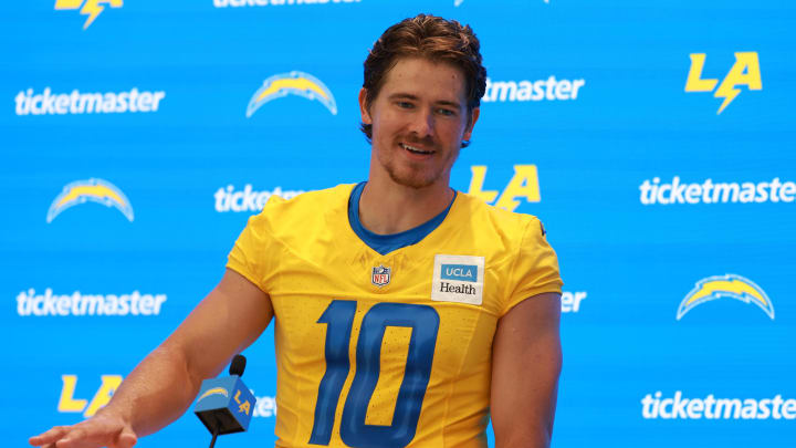 Jul 24, 2024; El Segundo, CA, USA;  Los Angeles Chargers quarterback Justin Herbert (10) speaks to the media after the first day of training camp at The Bolt. Mandatory Credit: Kiyoshi Mio-USA TODAY Sports