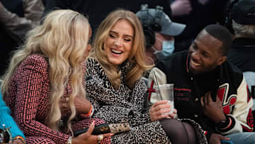 February 20, 2022; Cleveland, Ohio, USA; (L-R) American singer Mary J. Blige, Recording artist Adele, and American sports agent Rich Paul during the third quarter in the 2022 NBA All-Star Game at Rocket Mortgage FieldHouse. 