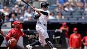 Jun 19, 2025; Bronx, New York, USA; New York Yankees center fielder Trent Grisham (12) follows through on a two run home run against the Los Angeles Angels during the second inning at Yankee Stadium. Mandatory Credit: Brad Penner-Imagn Images
