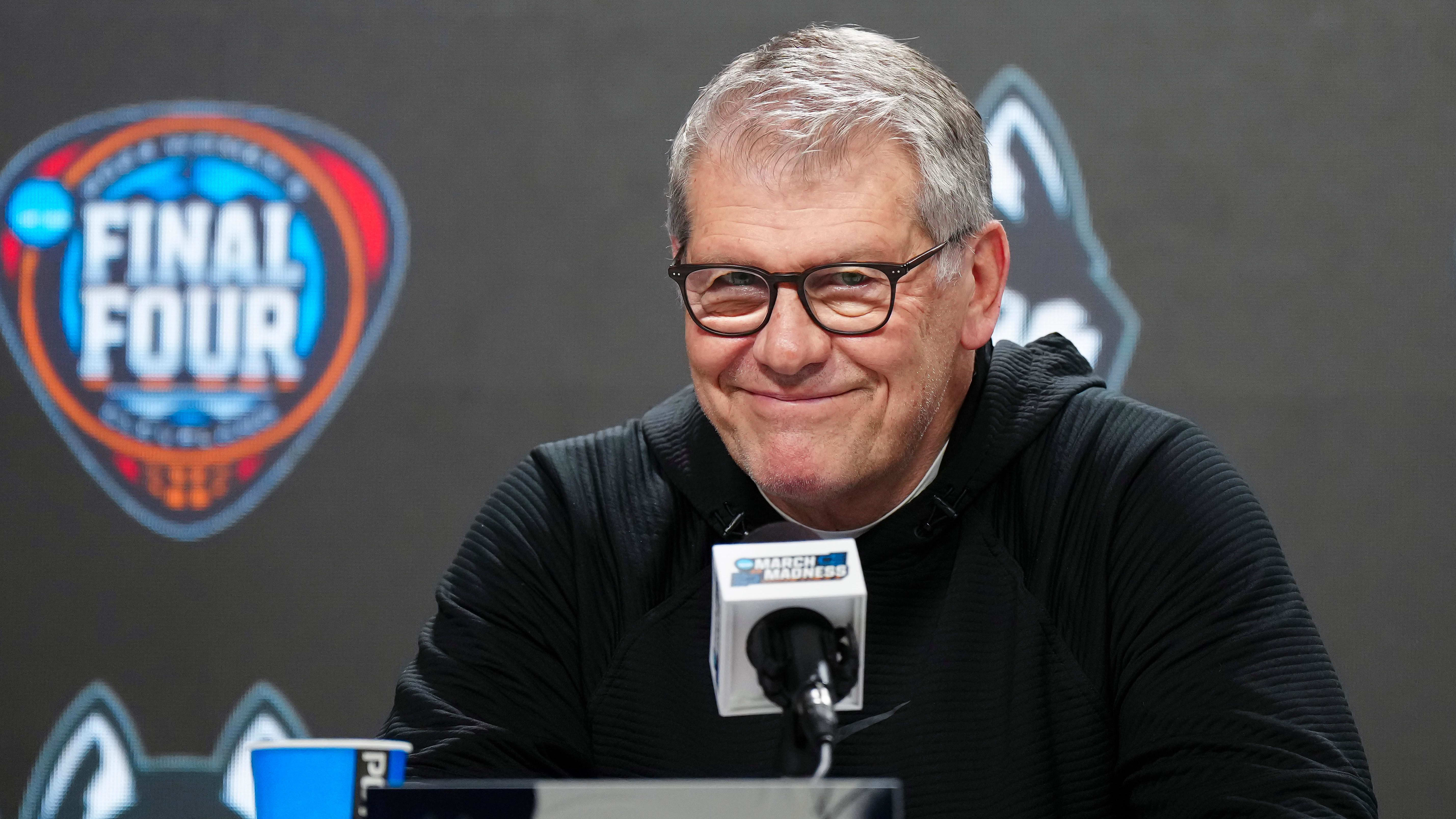 UConn Huskies coach Geno Auriemma smiles during a press conference.