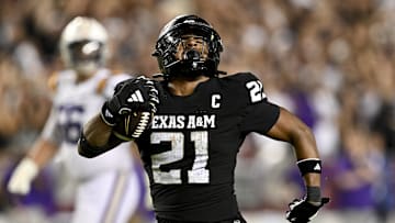 Oct 26, 2024; College Station, Texas, USA; Texas A&M Aggies linebacker Taurean York (21) reacts after catching the ball for an interception in the fourth quarter against the LSU Tigers at Kyle Field. Mandatory Credit: Maria Lysaker-Imagn Images. 
