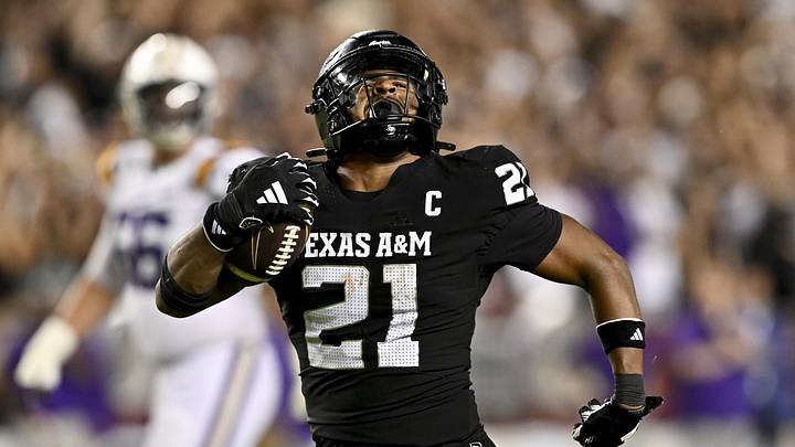 Oct 26, 2024; College Station, Texas, USA; Texas A&M Aggies linebacker Taurean York (21) reacts after catching the ball for an interception in the fourth quarter against the LSU Tigers at Kyle Field. Mandatory Credit: Maria Lysaker-Imagn Images. 