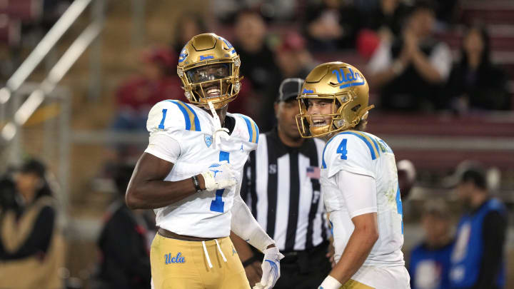 Oct 21, 2023; Stanford, California, USA; UCLA Bruins wide receiver J. Michael Sturdivant (1) celebrates with quarterback Ethan Garbers (4) after scoring a touchdown against the Stanford Cardinal during the third quarter at Stanford Stadium. Mandatory Credit: Darren Yamashita-USA TODAY Sports