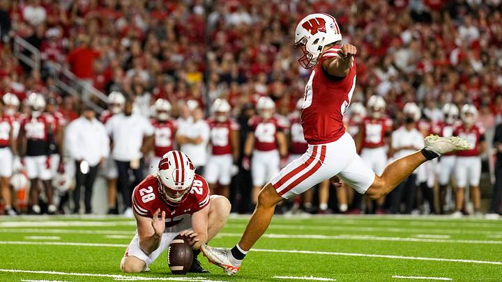 Aug 30, 2024; Madison, Wisconsin, USA;  Wisconsin Badgers kicker Nathanial Vakos (90) attempts to kick a field goal during the game against the Western Michigan Broncos at Camp Randall Stadium. Mandatory Credit: Jeff Hanisch-USA TODAY Sports