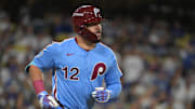 Oct 8, 2025; Los Angeles, California, USA; Philadelphia Phillies designated hitter Kyle Schwarber (12) rounds the bases hitting a solo home run off Los Angeles Dodgers pitcher Yoshinobu Yamamoto (18) during the fourth inning of game three of the NLDS during the 2025 MLB playoffs at Dodger Stadium. Mandatory Credit: Jayne Kamin-Oncea-Imagn Images