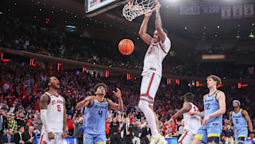 Feb 4, 2025; New York, New York, USA;  St. John's basketball guard Aaron Scott (0) dunks in the second half against the Marquette Golden Eagles at Madison Square Garden.