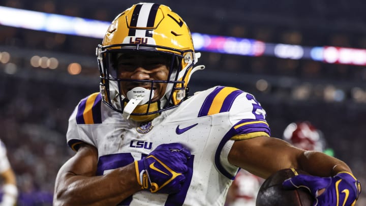 Nov 4, 2023; Tuscaloosa, Alabama, USA; LSU Tigers running back Josh Williams (27) carries the ball in for a touchdown against the Alabama Crimson Tide during the second half at Bryant-Denny Stadium. Mandatory Credit: Butch Dill-USA TODAY Sports