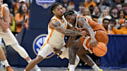 Mar 14, 2025; Nashville, TN, USA;  Tennessee Volunteers guard Bishop Boswell (3) pokes the ball from Texas Longhorns guard Tramon Mark (12) during the second half at Bridgestone Arena. Mandatory Credit: Steve Roberts-Imagn Images