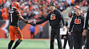 Oct 26, 2025; Cincinnati, Ohio, USA; Cincinnati Bengals wide receiver Ja'Marr Chase (1) shakes hands with head coach Zac Taylor during the fourth quarter against the New York Jets  at Paycor Stadium. Mandatory Credit: Joseph Maiorana-Imagn Images
