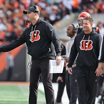 Oct 26, 2025; Cincinnati, Ohio, USA; Cincinnati Bengals wide receiver Ja'Marr Chase (1) shakes hands with head coach Zac Taylor during the fourth quarter against the New York Jets  at Paycor Stadium. Mandatory Credit: Joseph Maiorana-Imagn Images