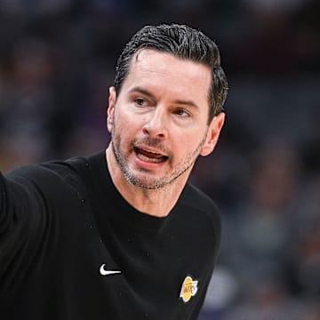 Oct 26, 2025; Sacramento, California, USA; Los Angeles Lakers head coach JJ Redick makes a call to the bench during the first quarter of the game against the Sacramento Kings at Golden 1 Center. Mandatory Credit: Ed Szczepanski-Imagn Images