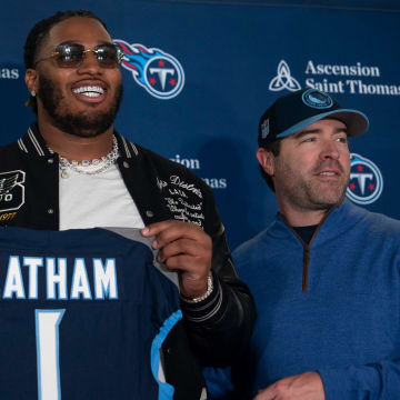 The Tennessee Titans first-round draft pick JC Latham poses with his new Titans jersey and General Manager Ran Carthon, left, and Head Coach Brian Callahan, right, at the teamÕs Ascension Saint Thomas Sports Park facility in Nashville, Tenn., Friday afternoon, April 26, 2024. The tackle was the No. 7 overall pick in the 2024 NFL Draft.